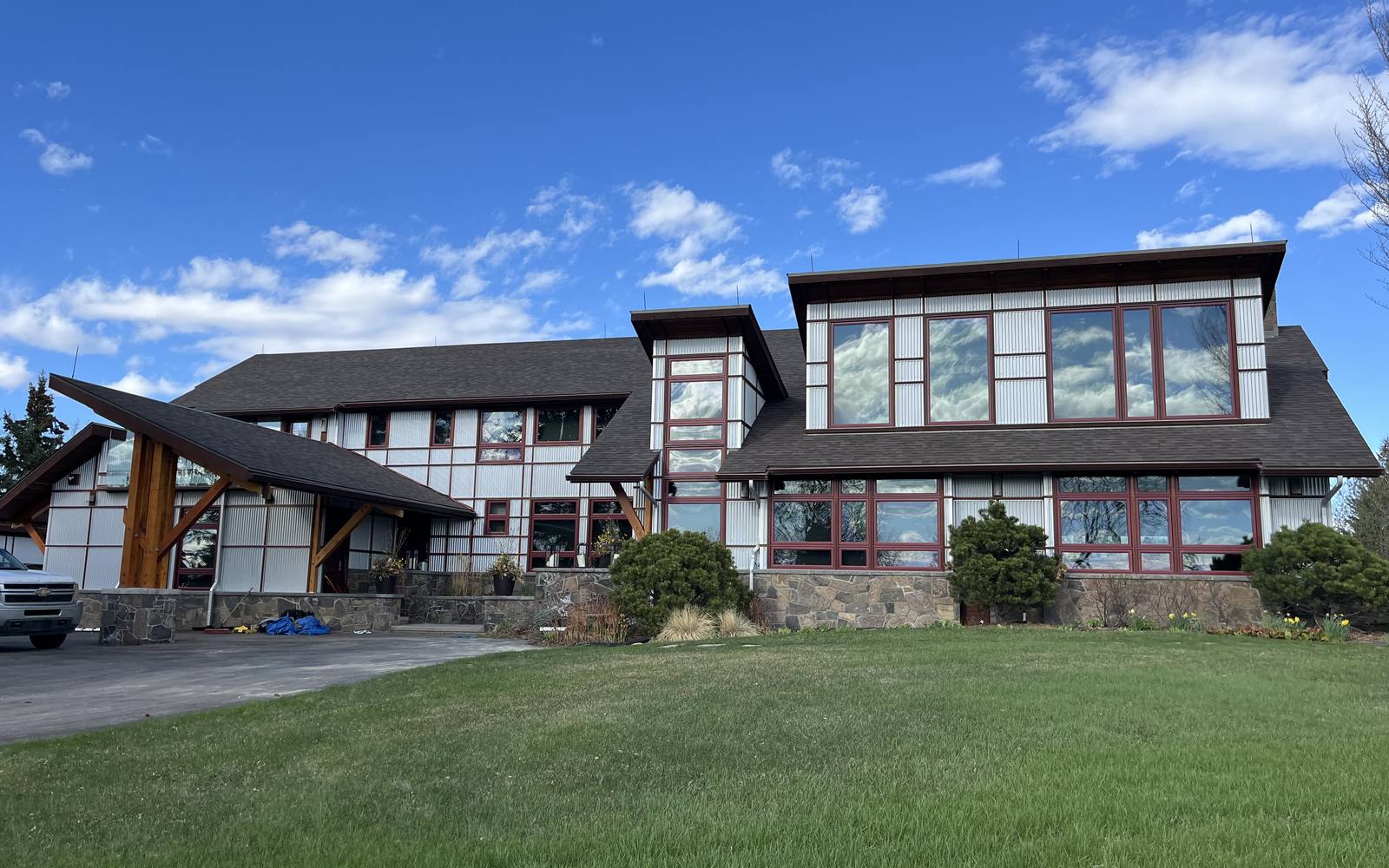 Calgary-area residential roof at dawn — local roofing services from Cochrane Insulation.
